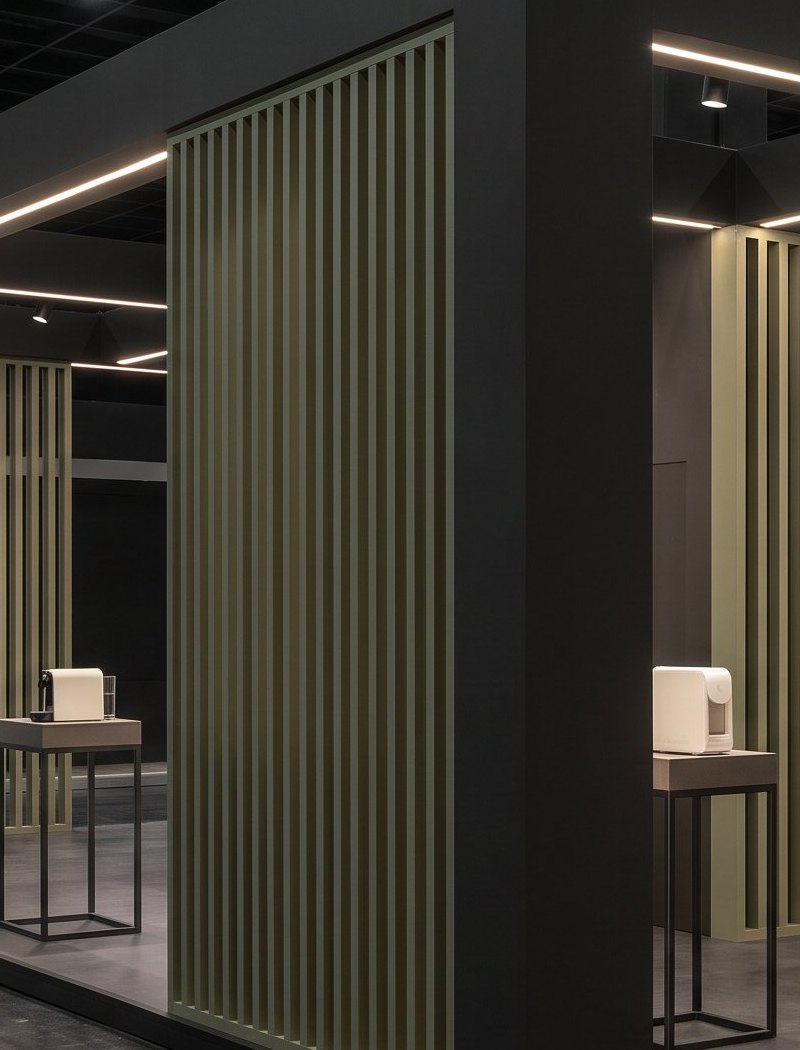 Corner detail of vertical sage slats and linear lighting